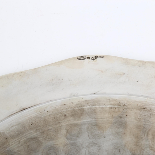 1478 - A large Portuguese silver serving platter, plain circular form with scalloped rim, eagle hallmark 91... 