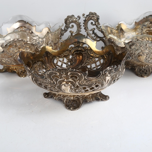 1479 - A set of 3 late 19th century German silver table centre bowls, with relief embossed foliate and pier... 