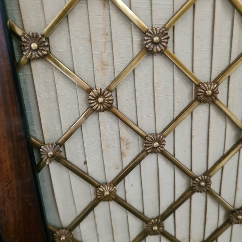 205 - A small Regency mahogany chiffonier, with lattice brass detail on doors, and ebonised insert detail,... 