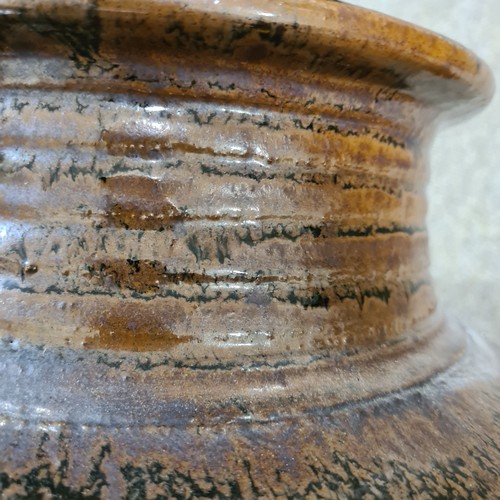 21 - A large studio pottery jar, Abuja Pottery, Nigeria, with incised fish designs and iridescent streaky... 