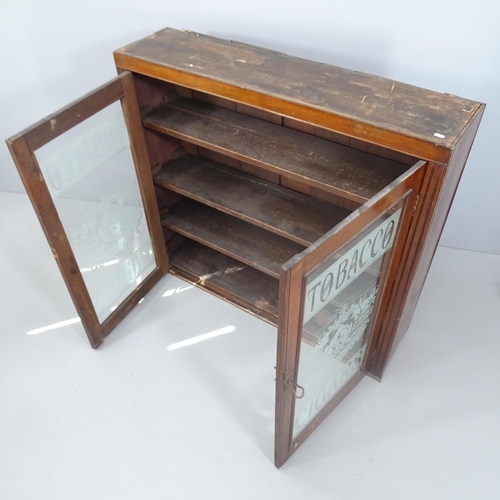 2109 - An antique mahogany tobacconist themed shop display cabinet with two glazed doors and three fixed sh... 