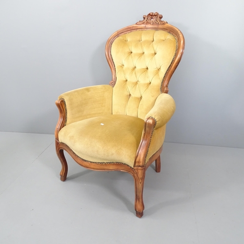 2120 - A French walnut and upholstered spoon back armchair.