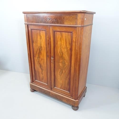 2124 - A Victorian mahogany linen press, with single drawer above two panelled doors and shelf fitted inter... 