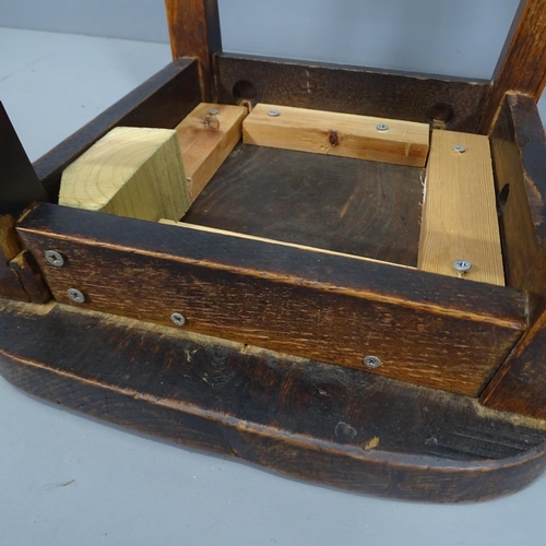 2128 - Two similar elm-seated school lab stools. Height 60cm.