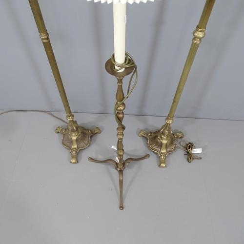 2130 - A pair of 1920s brass standard lamps, height to bayonet fitting 138cm, and another (3).