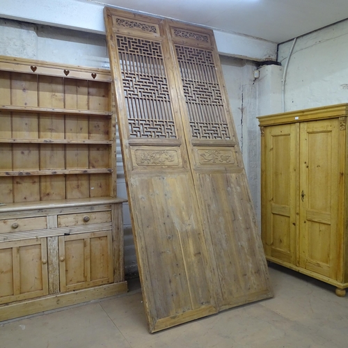 2131 - A pair of oriental doors / panels with applied carved and pierced decoration. Each 69x290cm.