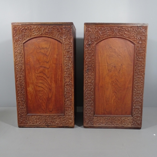 2133 - A pair of antique oak and mahogany cabinets, each having a single arch panelled door with applied ca... 