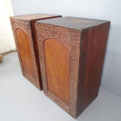 2133 - A pair of antique oak and mahogany cabinets, each having a single arch panelled door with applied ca... 