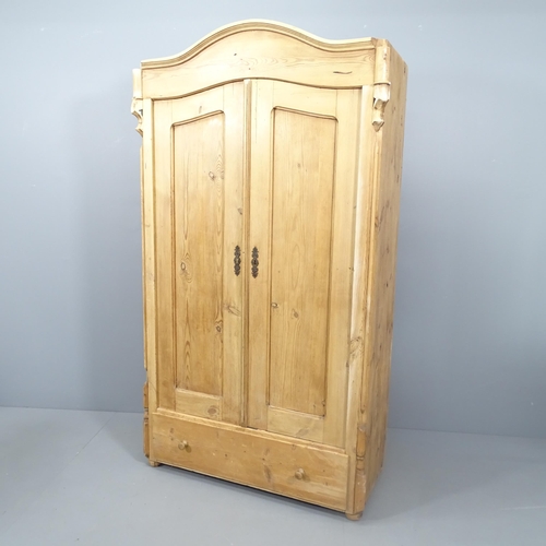 2136 - A continental pine two door arch top wardrobe, 103x181x45cm