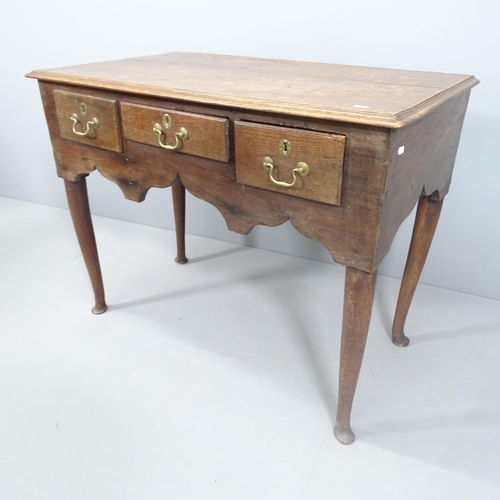 2143 - An 18th century oak lowboy with 3 drawers. 101x80x56cm.