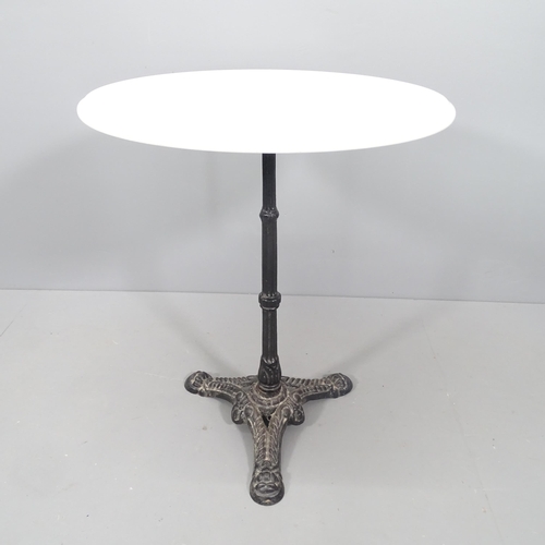 2144 - A circular white marble top bistro table on cast iron base. 61x71cm