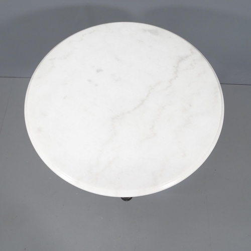 2144 - A circular white marble top bistro table on cast iron base. 61x71cm