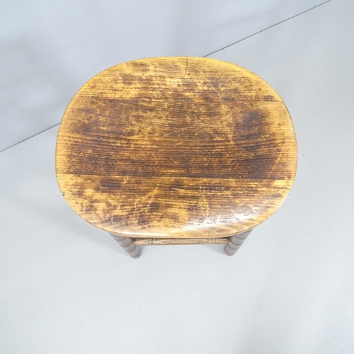 2145 - An oak bar stool. H76cm