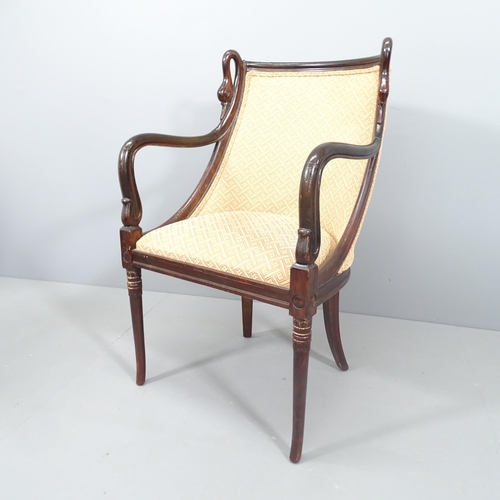 2146 - A Biedermeier style mahogany and upholstered open armchair with carved swan neck decoration.