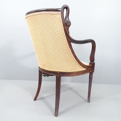 2146 - A Biedermeier style mahogany and upholstered open armchair with carved swan neck decoration.