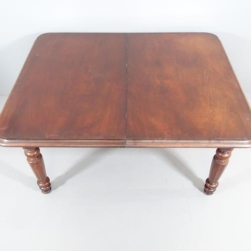 2148 - An antique mahogany drawer leaf dining table, with two spare leaves and raised on turned legs. 155 (... 