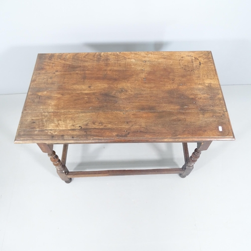 2159 - An 18th century joined oak centre table, raised on turned legs. 100x70x58cm