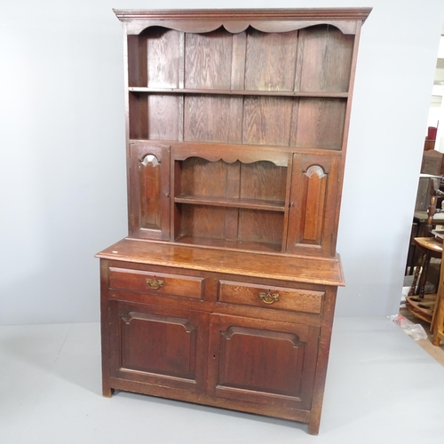 2173 - An antique oak 2 section dresser, with 2 drawers and 2 cupboard doors. 120x197x46cm.