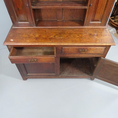 2173 - An antique oak 2 section dresser, with 2 drawers and 2 cupboard doors. 120x197x46cm.