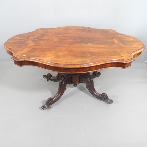 2178 - A 19th century rosewood tilt top Loo table, raised on a turned centre column and sabre leg base. 148... 