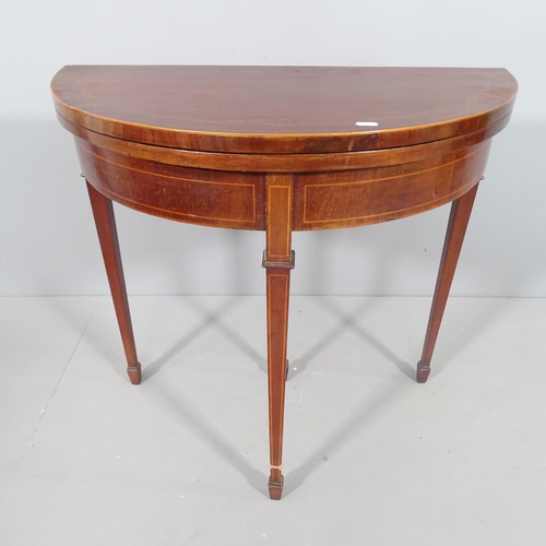 2181 - A late Victorian mahogany and satinwood banded demi lune fold over card table, of small size, raised... 