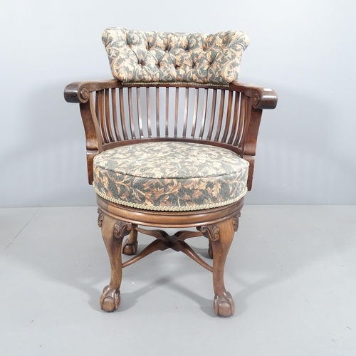 2190 - A Victorian mahogany revolving bow arm office chair, button back upholstered, raised on cabriole leg... 