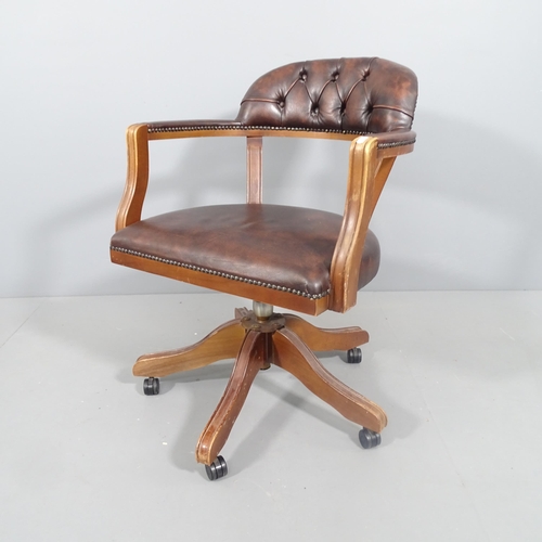 2191 - A reproduction studded leather swivel bow arm office chair