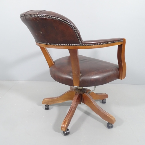 2191 - A reproduction studded leather swivel bow arm office chair