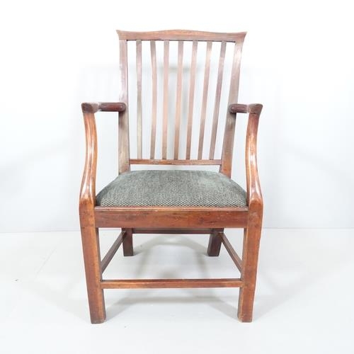 2192 - A Georgian oak armchair with upholstered seat.