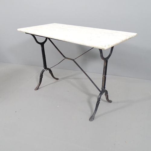 2194 - A rectangular marble topped garden table on cast iron base. 103x73x50cm.