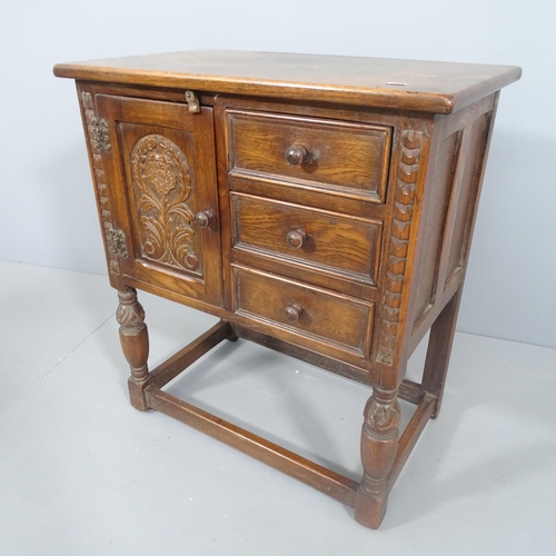 2196 - A 17th century style oak cabinet, fitted with three drawers and cupboard. 65x73x38cm