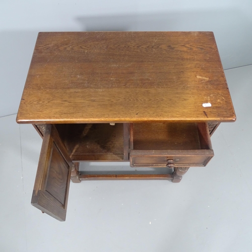 2196 - A 17th century style oak cabinet, fitted with three drawers and cupboard. 65x73x38cm