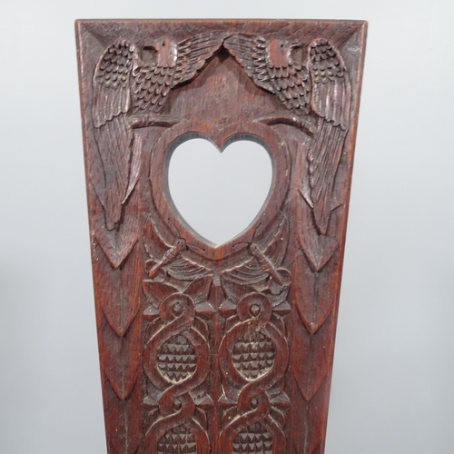 2199 - An arts & crafts Welsh oak spinning stool, relief carved back. 
Carved to the reverse E.A.A 1892. H ... 