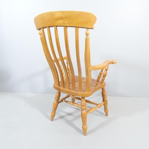 2202 - A light oak Windsor kitchen armchair.