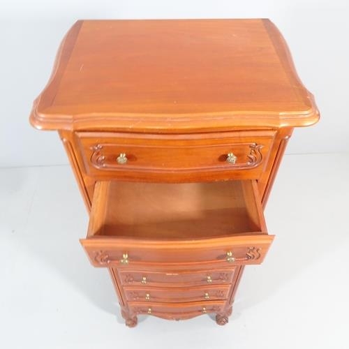 2207 - A French cherrywood narrow chest of seven drawers. 57x134x43cm.