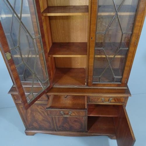 2208 - A Georgian style flame mahogany 2-section bookcase with 3 glazed doors, 3 drawers and 3 cupboard doo... 