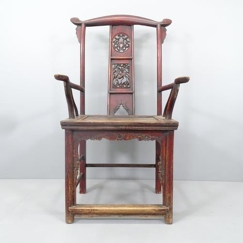 2211 - An antique elm Chinese emperor's throne chair, with carved and pierced decoration. Overall 68x118x52... 