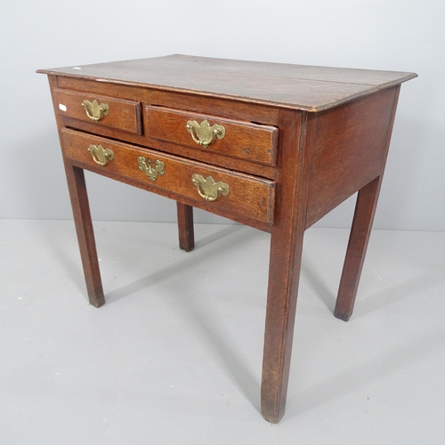 2222 - A George lll oak low boy, fitted with two short and one long drawer, raised on square chamfered legs... 