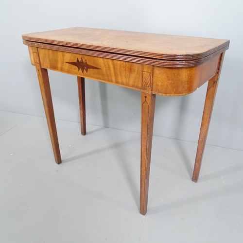 2226 - A regency mahogany fold over tea table, raised on ebony banded tapered legs. 91x74x44cm, opening to ... 