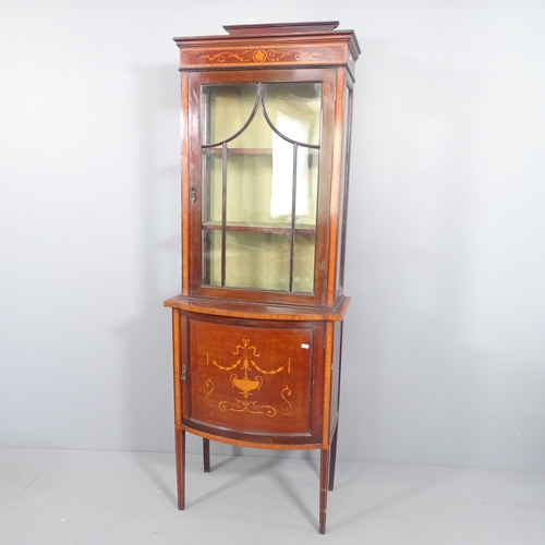 2229 - A late Victorian mahogany display cabinet, single glazed door above a bow fronted cupboard base, mar... 