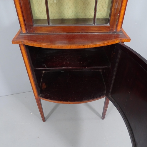 2229 - A late Victorian mahogany display cabinet, single glazed door above a bow fronted cupboard base, mar... 