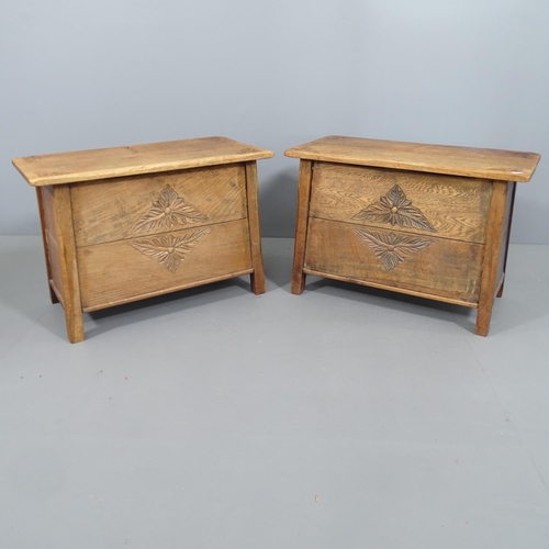 2235 - A pair of carved oak sewing cabinets. 67x45x35cm