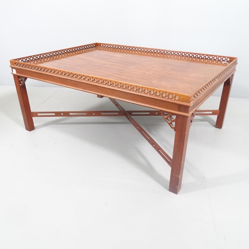 2240 - A mahogany Chippendale style mahogany silver table, on cross stretcher, with pierced gallery and dec... 