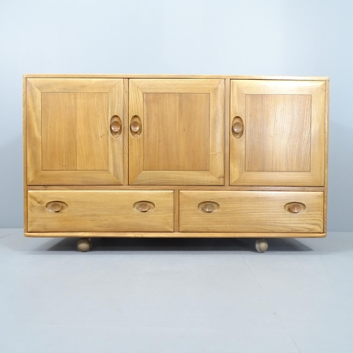 2000 - A Mid-Century Ercol Windsor model 468 sideboard, in Golden Dawn with three cupboards and drawers und... 