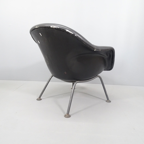 2021 - A mid century black leather upholstered lounge chair, raised on tubular metal legs.