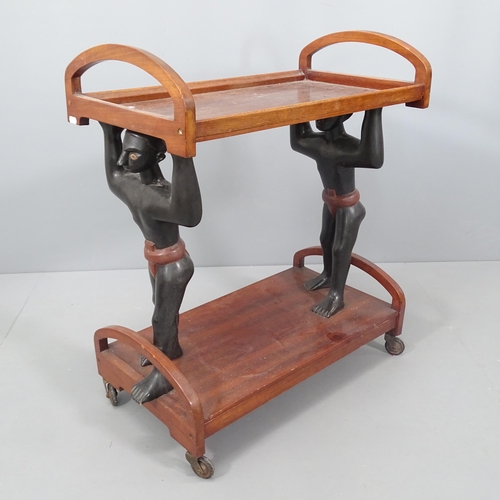 2022 - A mid-century mahogany two-tier drinks trolley, with blackamoor figure supports. 68x78x36cm.