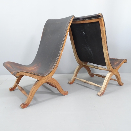 2023 - A pair of black studded leather upholstered slipper chairs with oak frame, in the manner of Pierre L... 