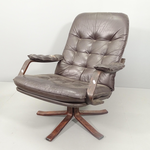 2024 - A mid-century bentwood and black leather upholstered armchair.