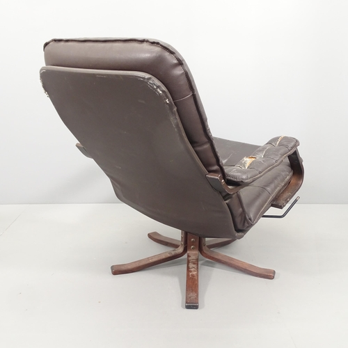 2024 - A mid-century bentwood and black leather upholstered armchair.