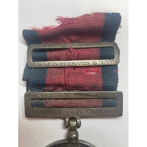 12 - A pair of 19th century campaign medals, comprising a Wellington Waterloo 1815 medal with bars inscri... 